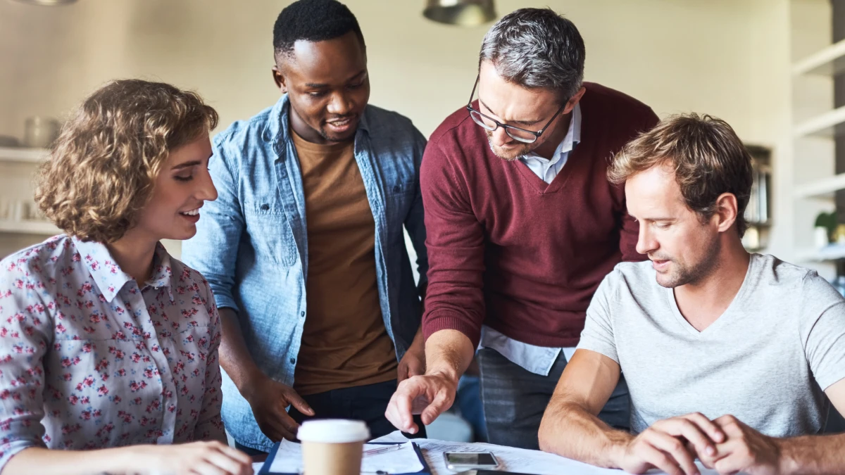Co-workers in office working at boardroom table